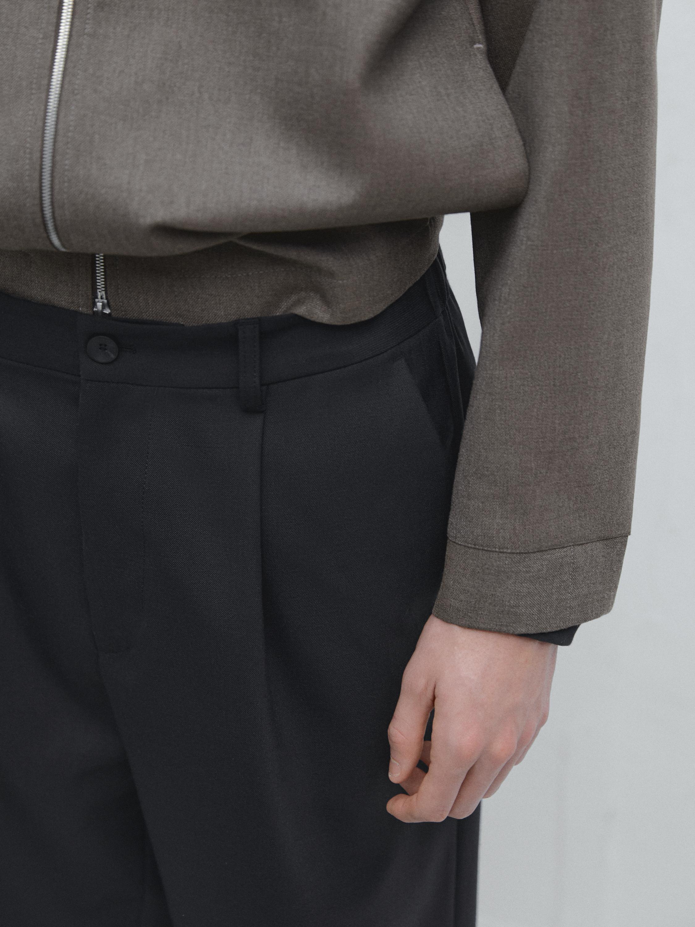 Pantalon relaxed fit à pinces en laine mélangée